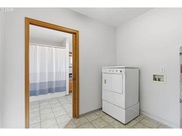 a view of a utility room with a hallway