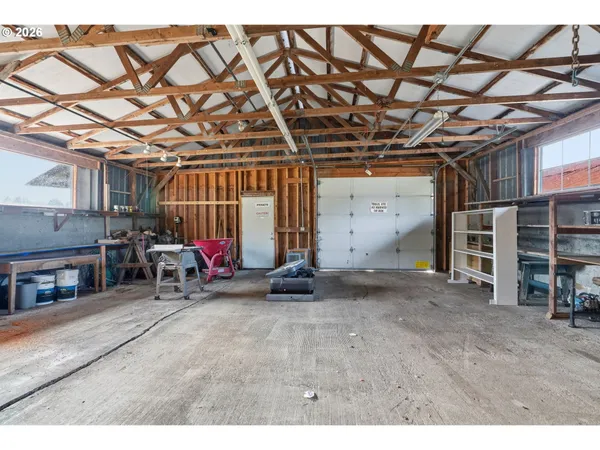 a view of a room with wooden shelves