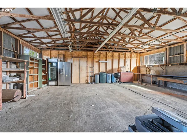 a view of a room with lots of wooden furniture