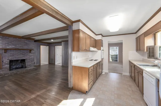 a large kitchen with a stove top oven