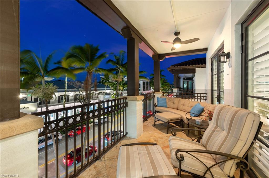 780 5th Avenue South, Unit 302 Naples, FL 34102 - Photo 1 of 20 a view of a chairs and tables in patio