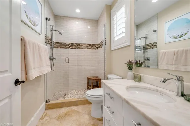 a view of a balcony with chairs and table