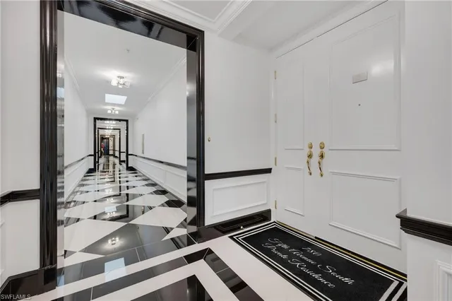 a kitchen with a stove a sink a counter space dining table and chairs