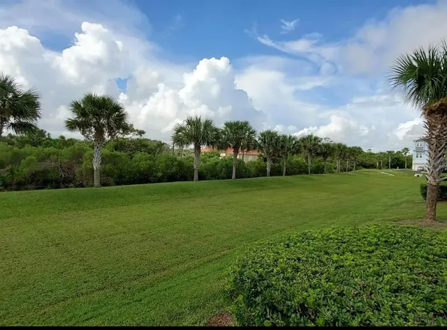 a view of a golf course with a garden