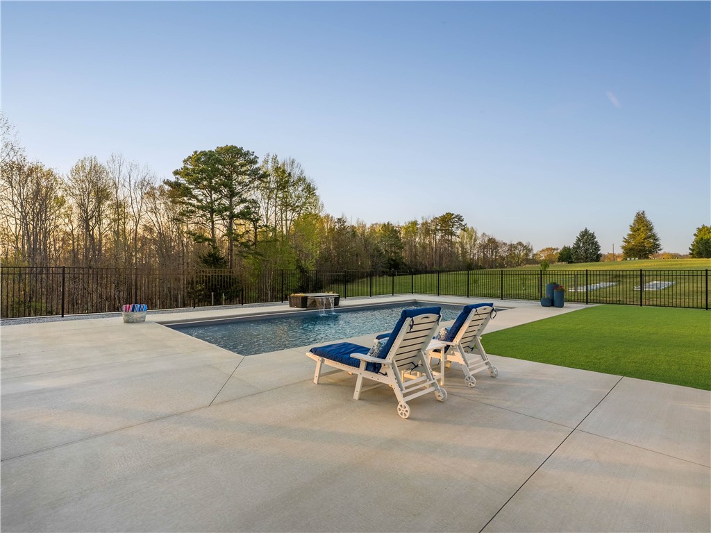 331 Bakerville Road Easley, SC 29642 - Photo 40 of 43 Relax poolside and enjoy serene outdoor living in this expansive backyard retreat.