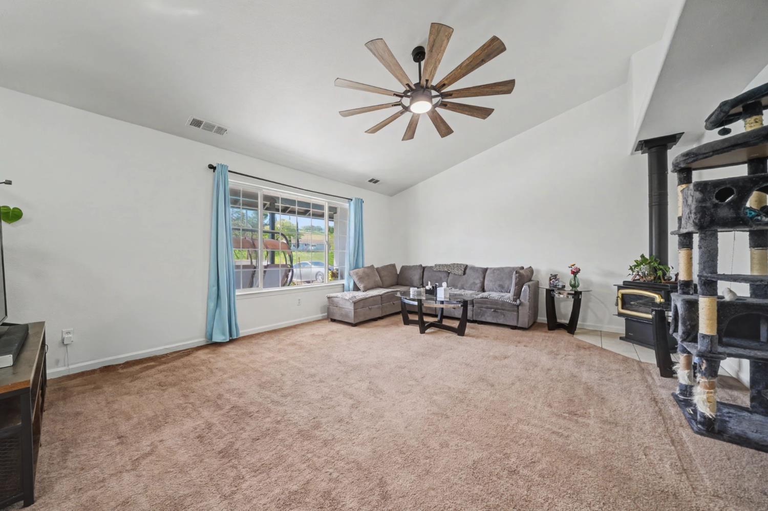 7761 Jenny Lind Road Valley Springs, CA 95252 - Photo 4 of 35 a view of a livingroom with workspace and a window
