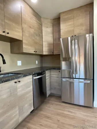 a stove top oven sitting inside of a kitchen