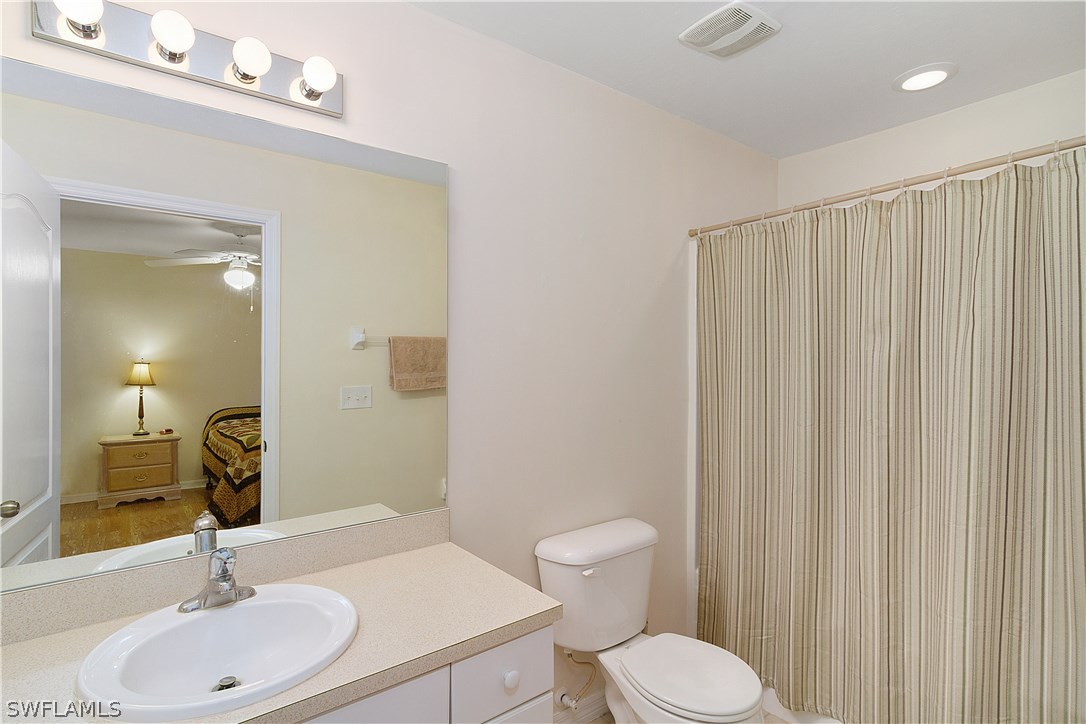 3002 52nd Street West Lehigh Acres, FL 33971 - Photo 11 of 18 a bathroom with a sink toilet and shower