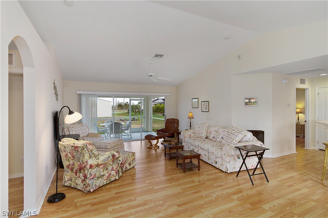 3002 52nd Street West Lehigh Acres, FL 33971 - Photo 3 of 18 a living room with furniture and a large window