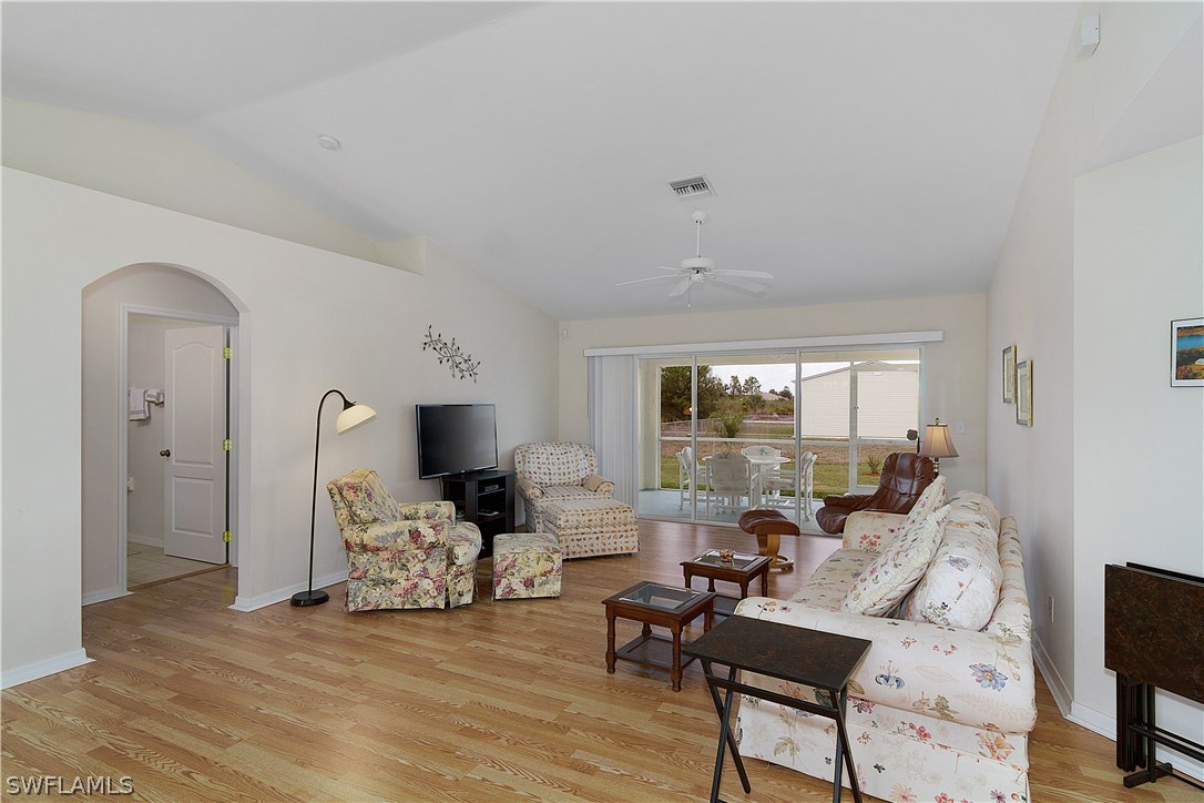 3002 52nd Street West Lehigh Acres, FL 33971 - Photo 4 of 18 a living room with furniture and a large window
