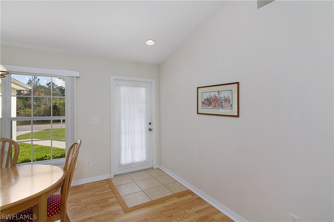 3002 52nd Street West Lehigh Acres, FL 33971 - Photo 5 of 18 a view of room with window and wooden floor
