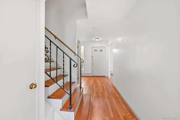 a view of entryway with wooden floor