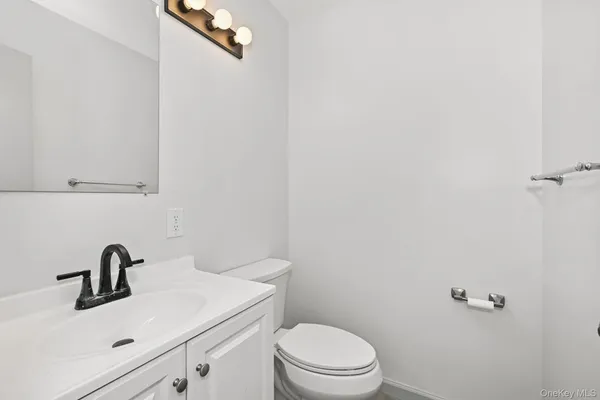 a bathroom with a sink and mirror