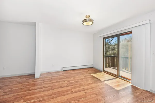 a view of an empty room and window
