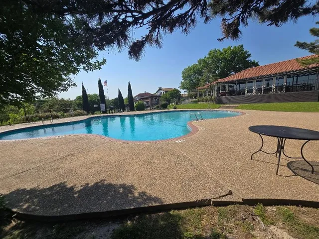 a view of a lake with a house in the background