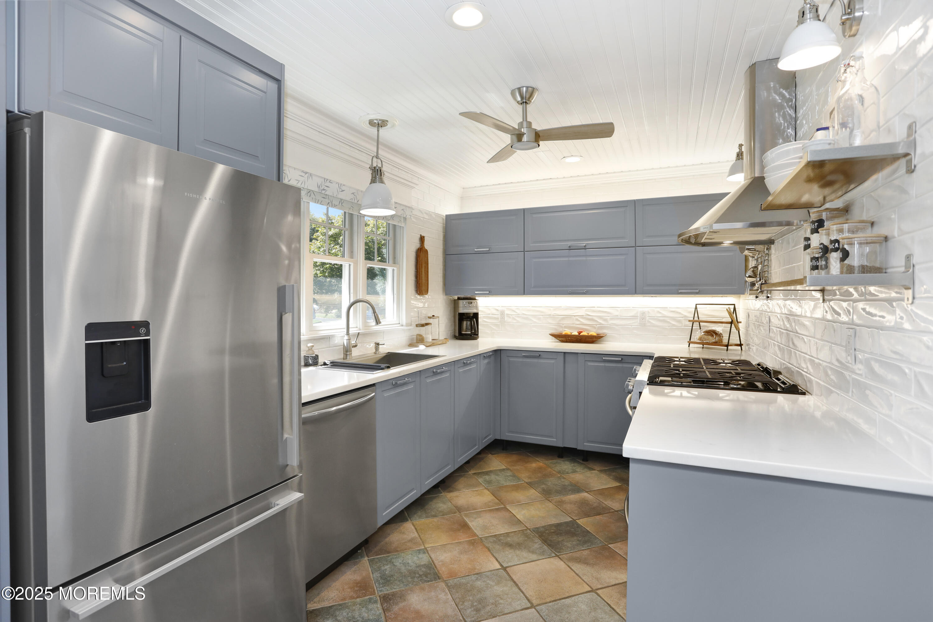 1706 Forest Street Wall, NJ 07719 - Photo 16 of 61 a kitchen with a sink stainless steel appliances and cabinets