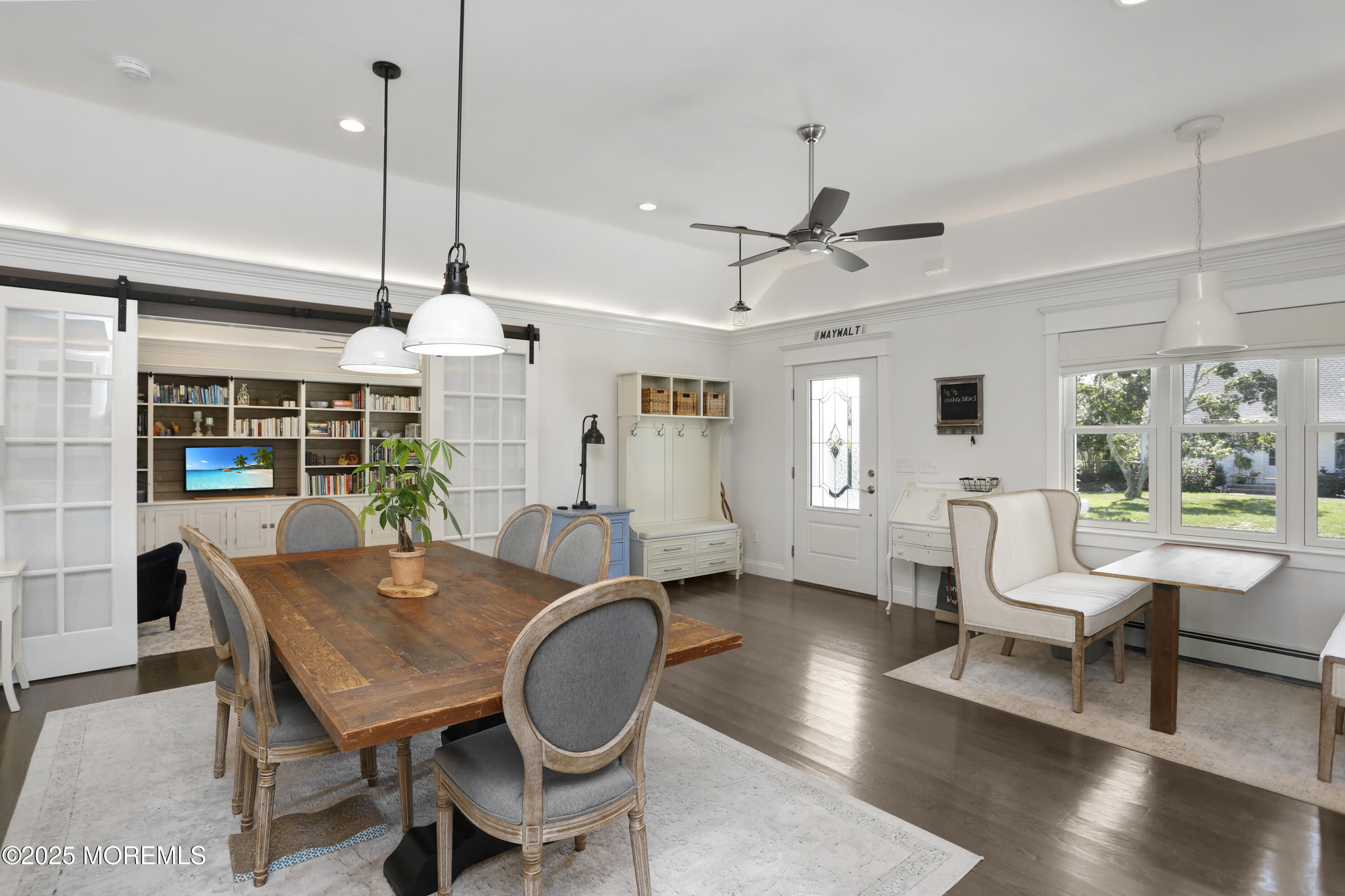 1706 Forest Street Wall, NJ 07719 - Photo 20 of 61 a dining room with furniture a chandelier and wooden floor