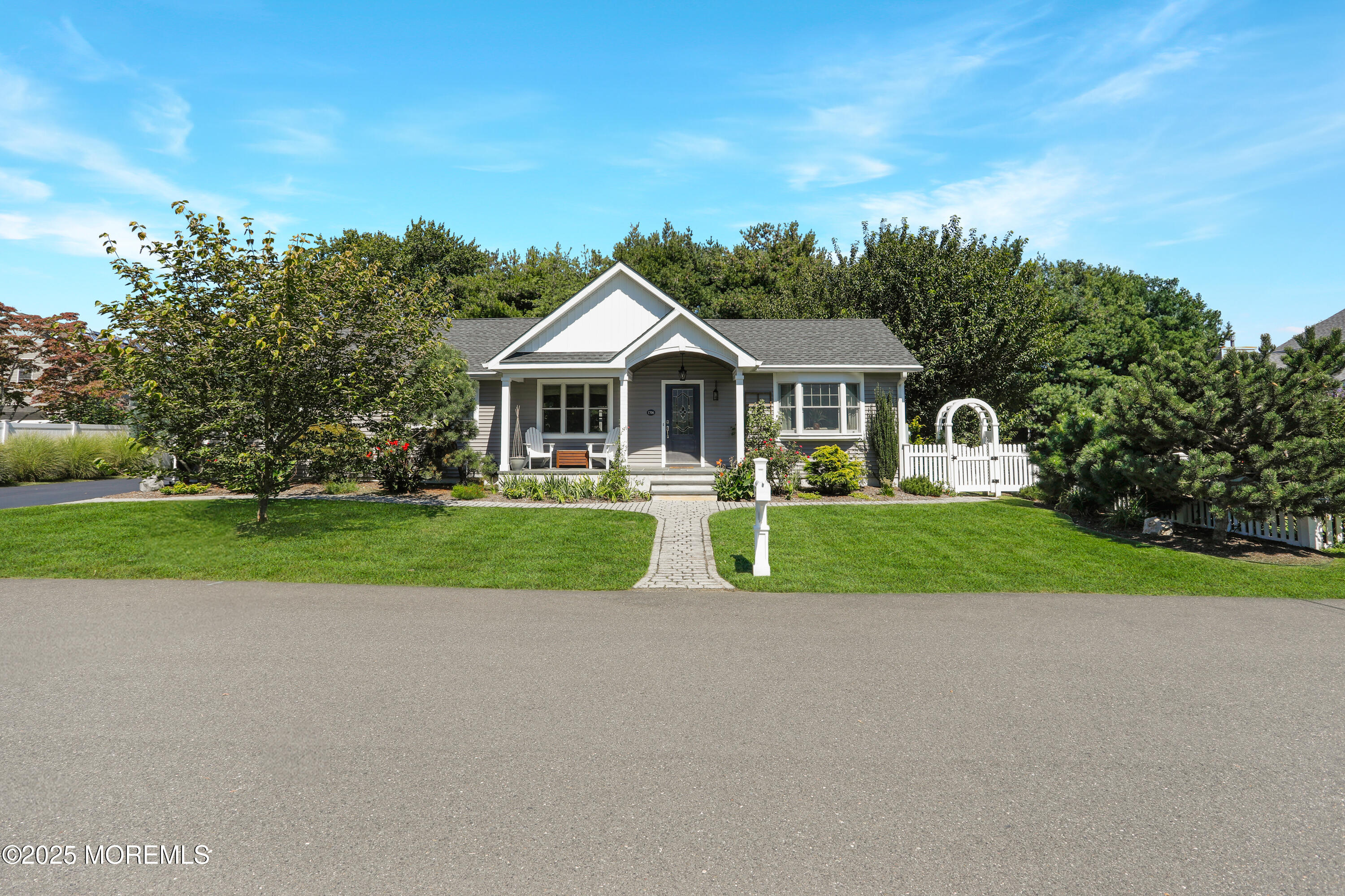 1706 Forest Street Wall, NJ 07719 - Photo 2 of 61 a front view of a house with a yard and potted plants
