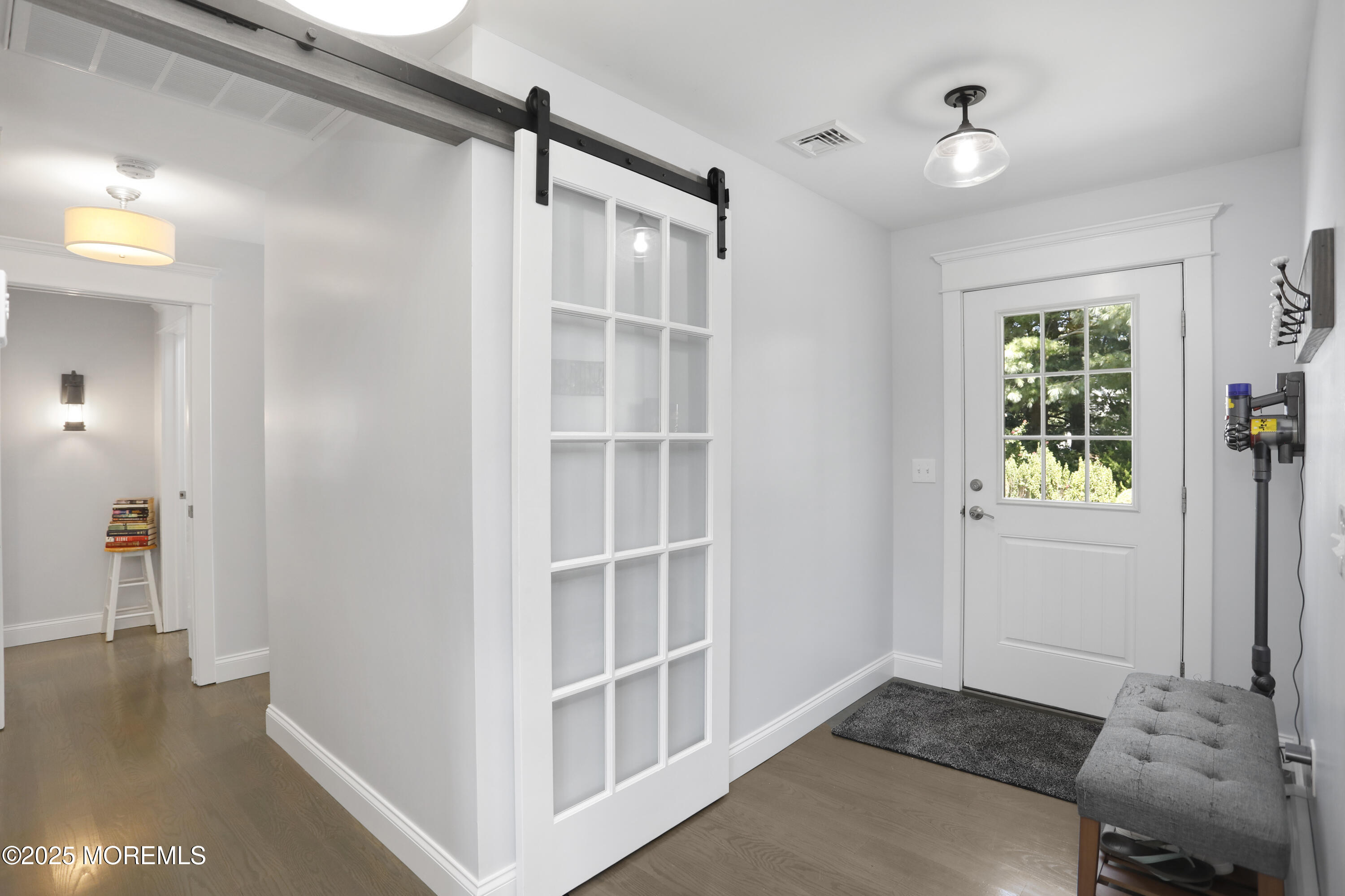 1706 Forest Street Wall, NJ 07719 - Photo 27 of 61 a view of an empty room with wooden floor and a window