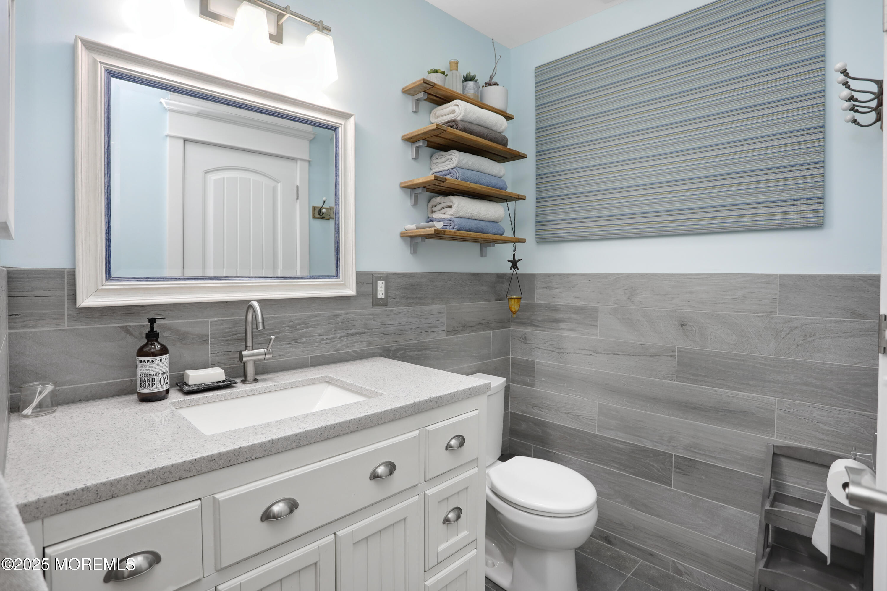 1706 Forest Street Wall, NJ 07719 - Photo 34 of 61 a bathroom with a granite countertop toilet sink and mirror