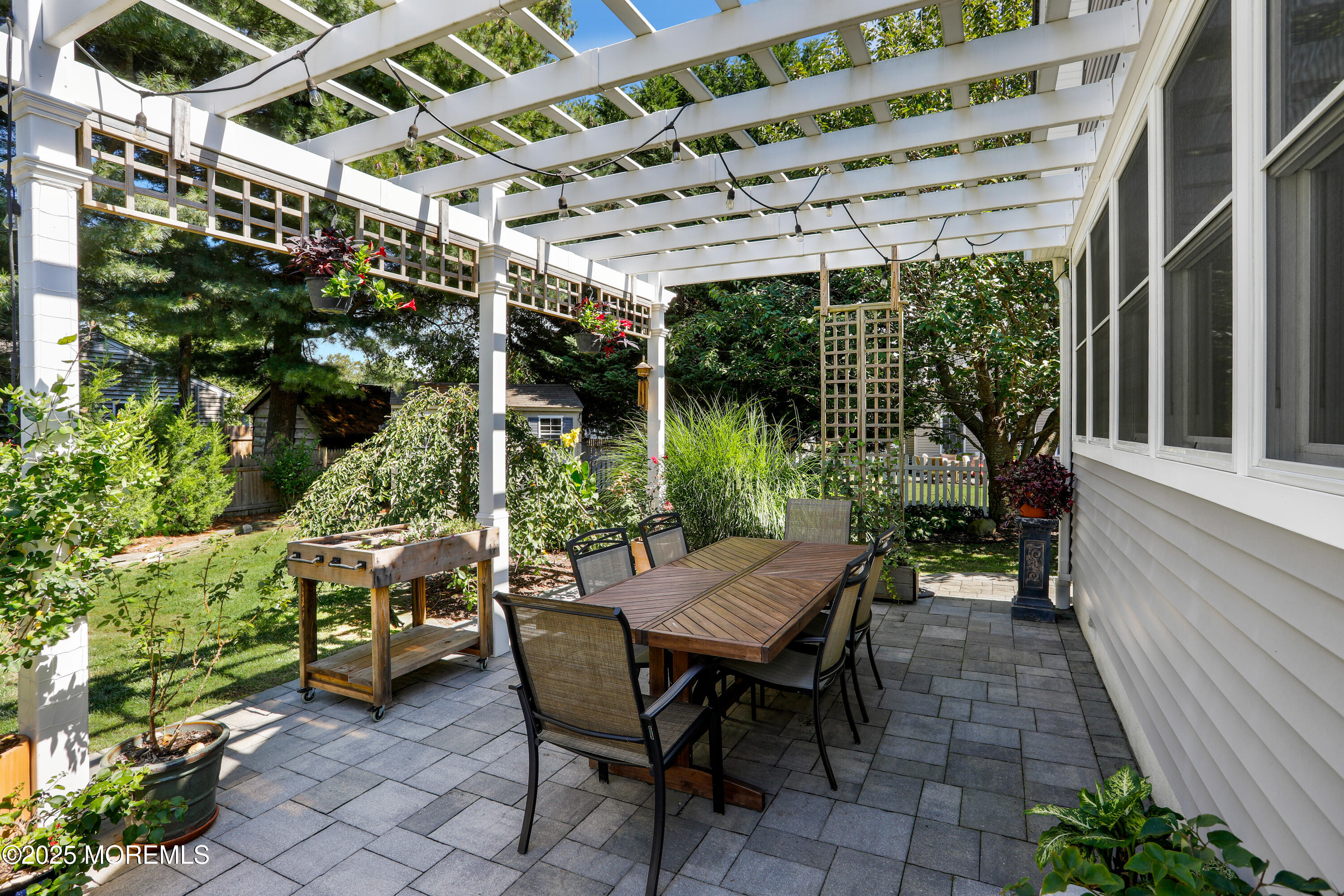 1706 Forest Street Wall, NJ 07719 - Photo 43 of 61 a view of patio with a table and chairs under an umbrella
