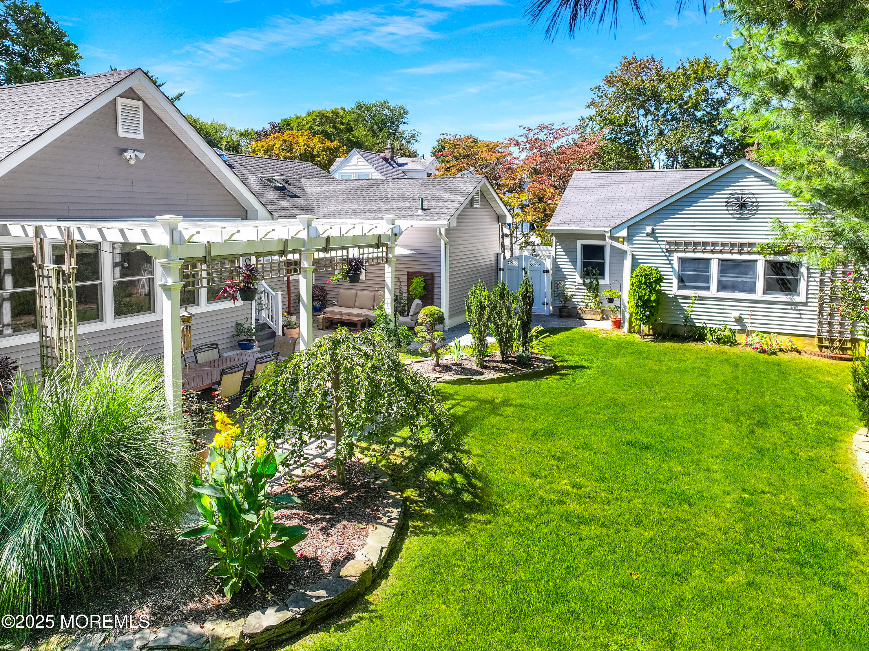 1706 Forest Street Wall, NJ 07719 - Photo 44 of 61 a front view of a house with a yard table and chairs