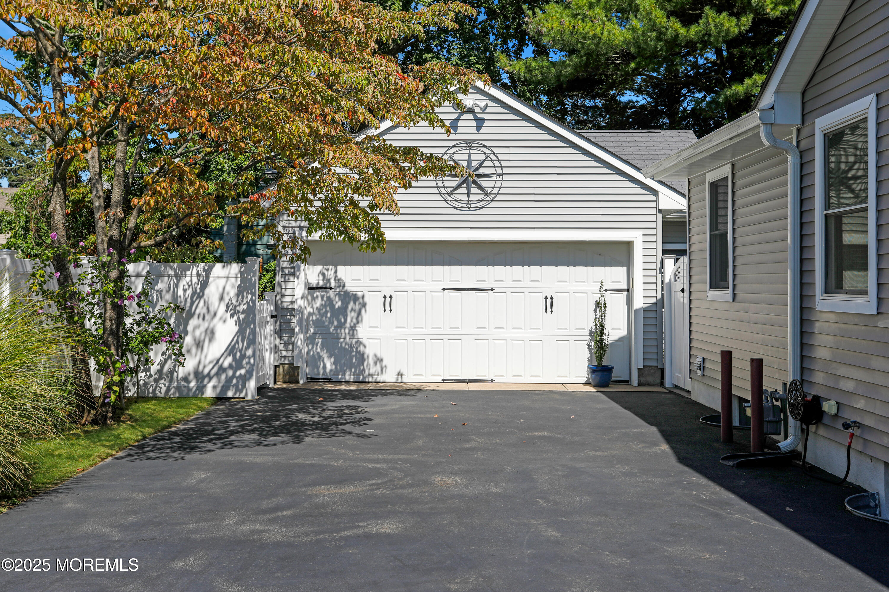 1706 Forest Street Wall, NJ 07719 - Photo 49 of 61 a view of a house with a small yard and a large tree