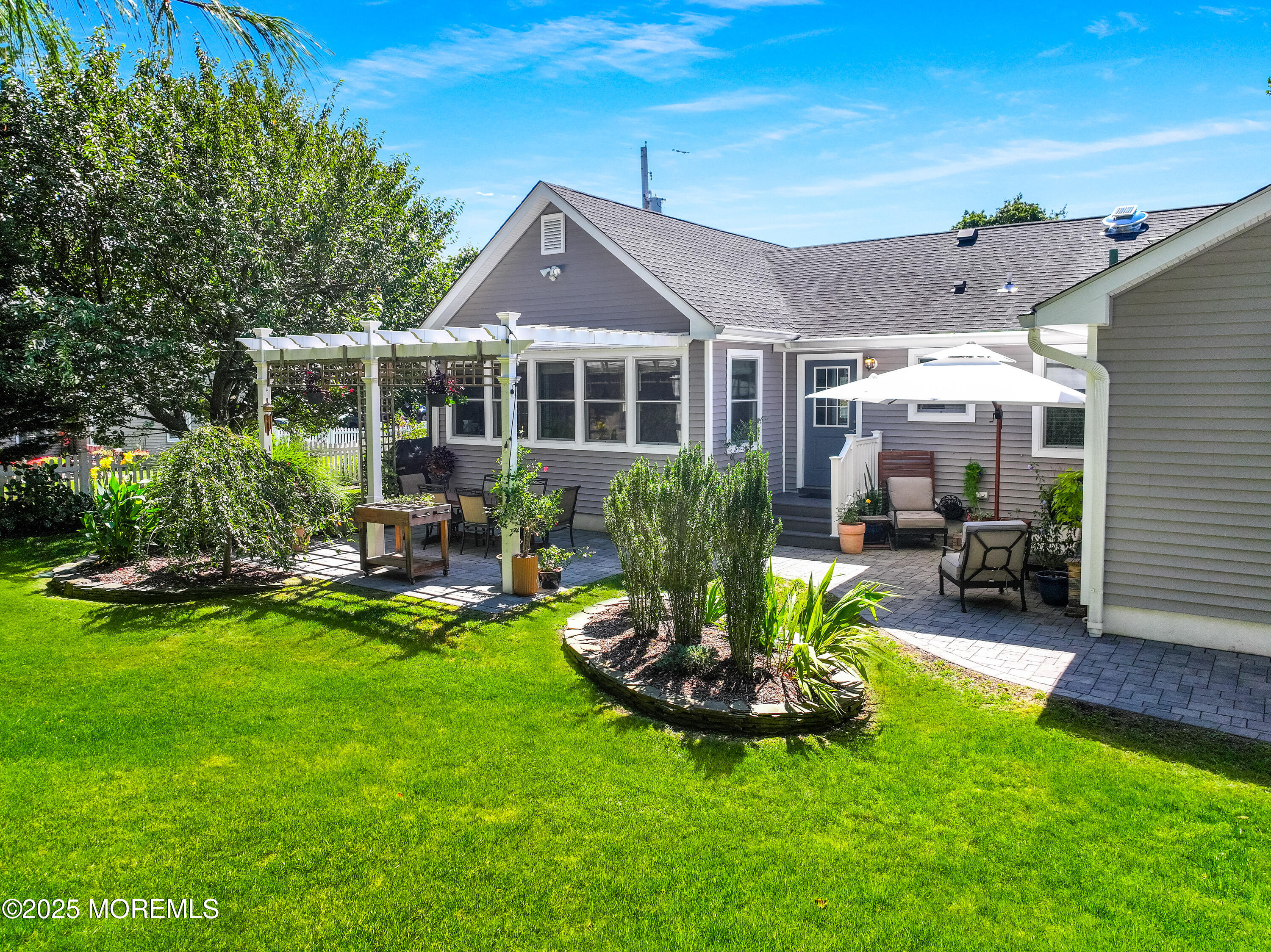 1706 Forest Street Wall, NJ 07719 - Photo 54 of 61 a view of a house with a yard porch and sitting area