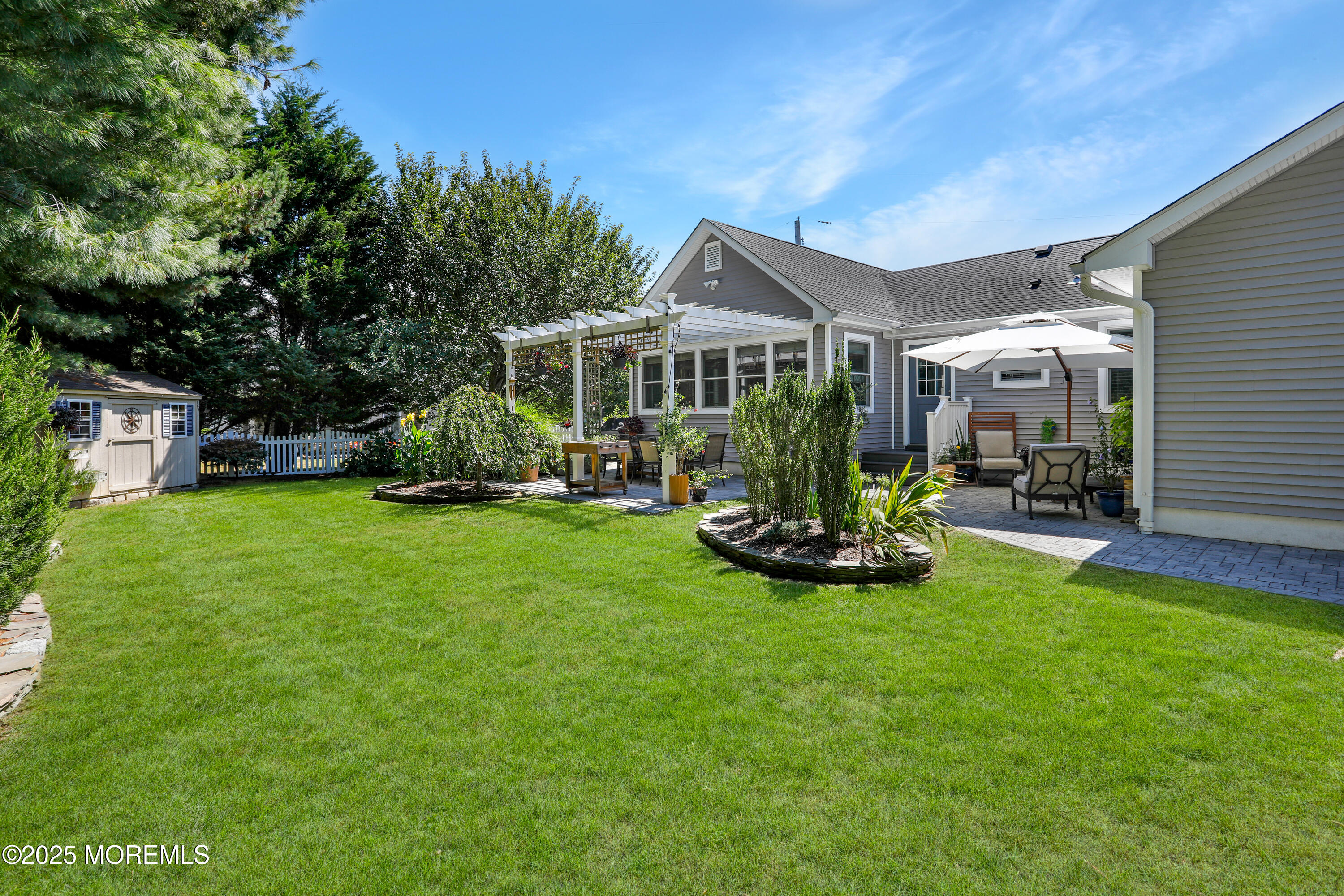 1706 Forest Street Wall, NJ 07719 - Photo 55 of 61 a view of a house with backyard porch and garden