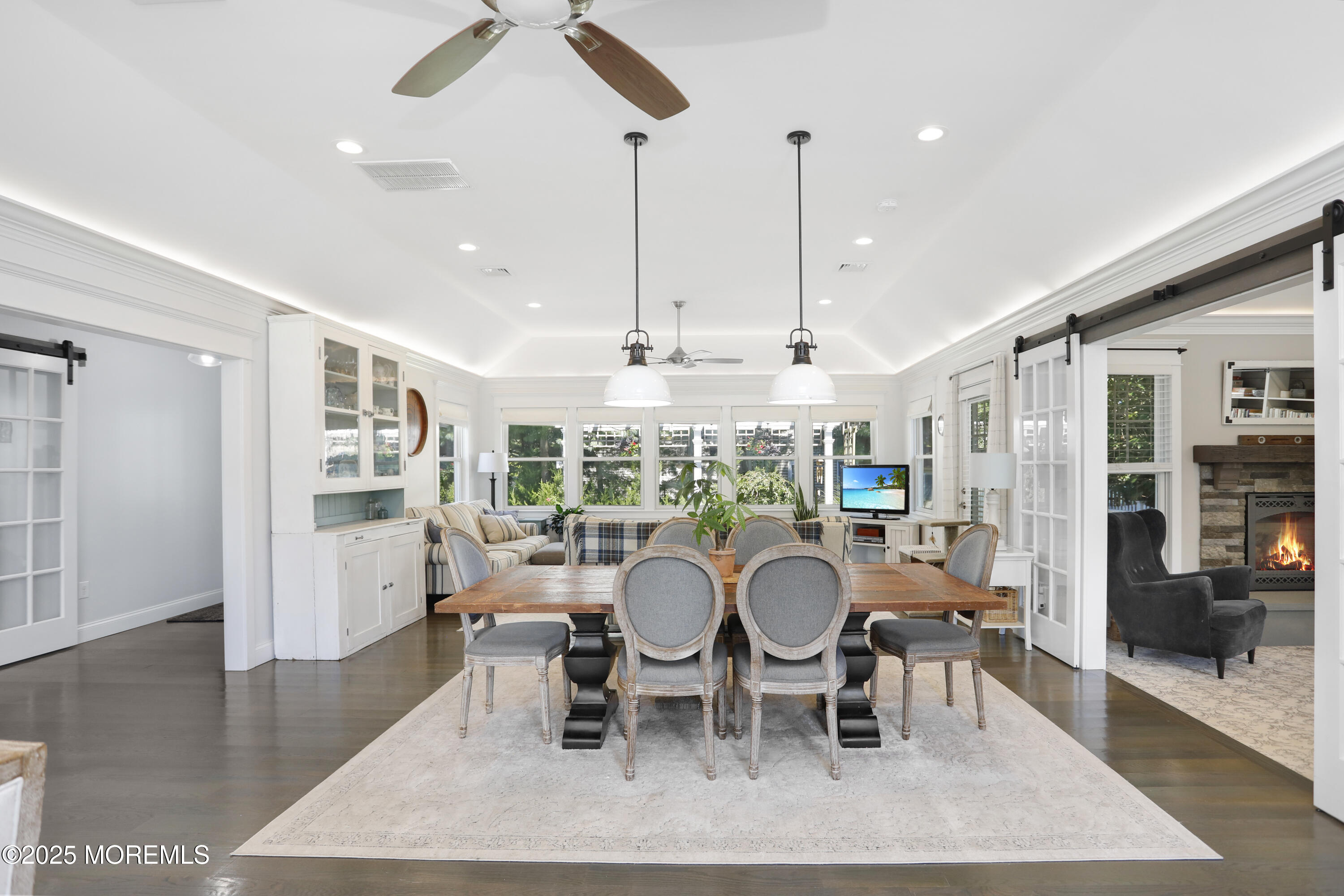 1706 Forest Street Wall, NJ 07719 - Photo 8 of 61 a dining room with furniture a chandelier and wooden floor