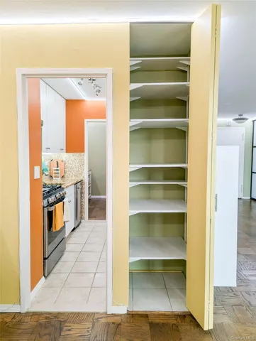 a kitchen with a refrigerator and a stove