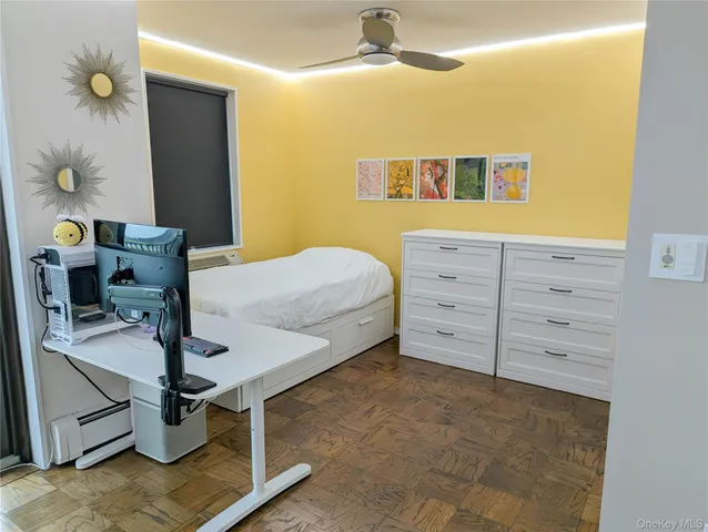 a bed room with a bed and a chandelier