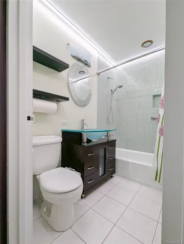 a bathroom with a sink a toilet and bathtub