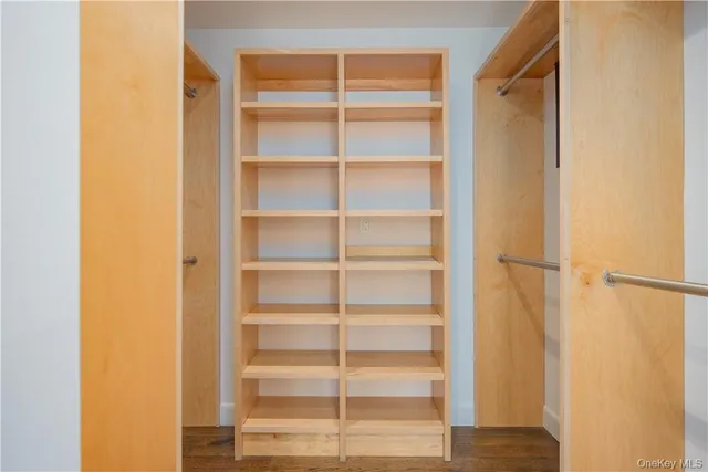 a bathroom with a bathtub a sink a window and a shower