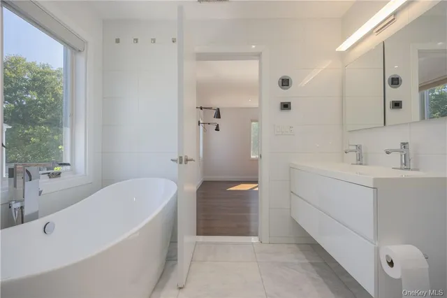 a bathroom with a shower a toilet and sink