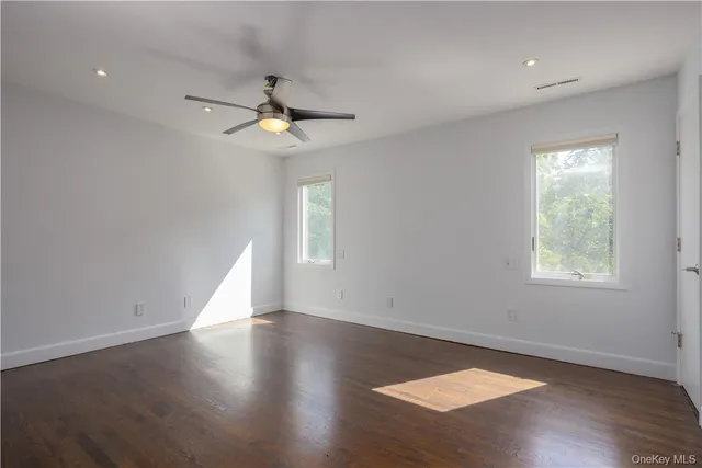 a white toilet sitting next to a bathroom sink