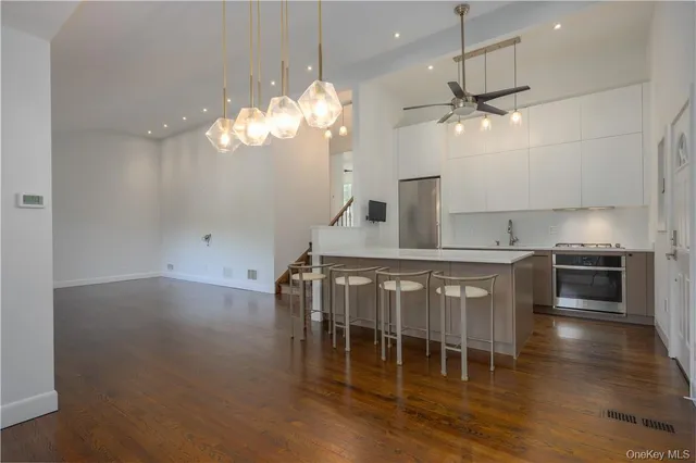 a kitchen with a sink cabinets and window