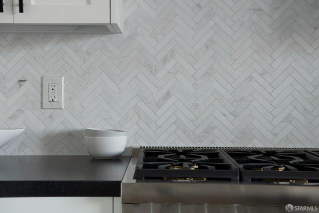 a bathroom with a sink double vanity granite tub shower and a mirror