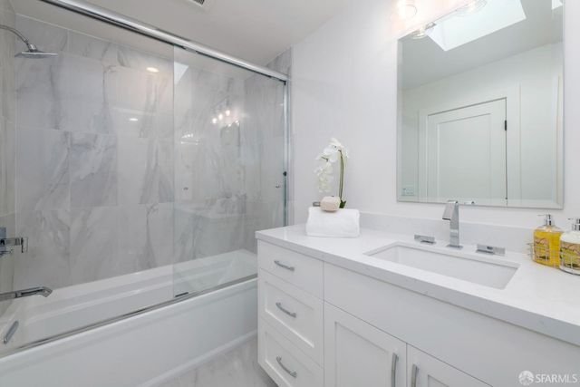 a view of room with furniture and wooden floor