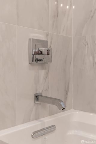 a bathroom with double sink and a mirror