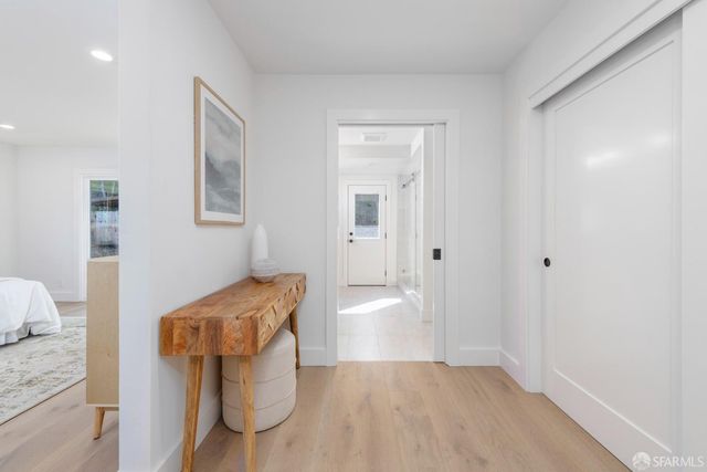 a spacious bedroom with a large bed and a window