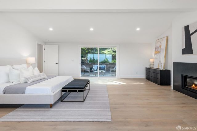 a view of a balcony with chair and wooden floor