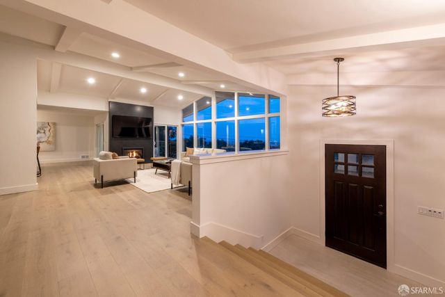 an aerial view of a house with yard swimming pool and outdoor seating