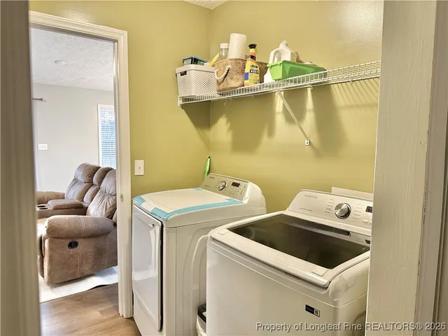 a utility room with dryer and washer