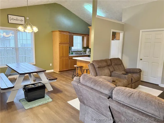 a living room with furniture and a table