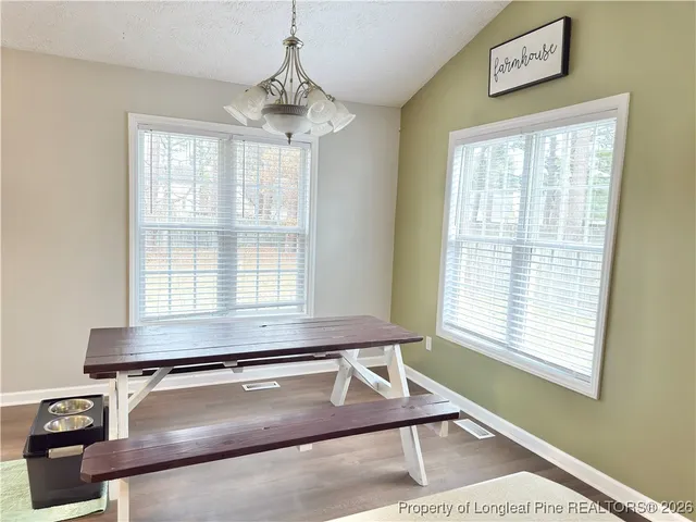 a room with gym equipment and large window