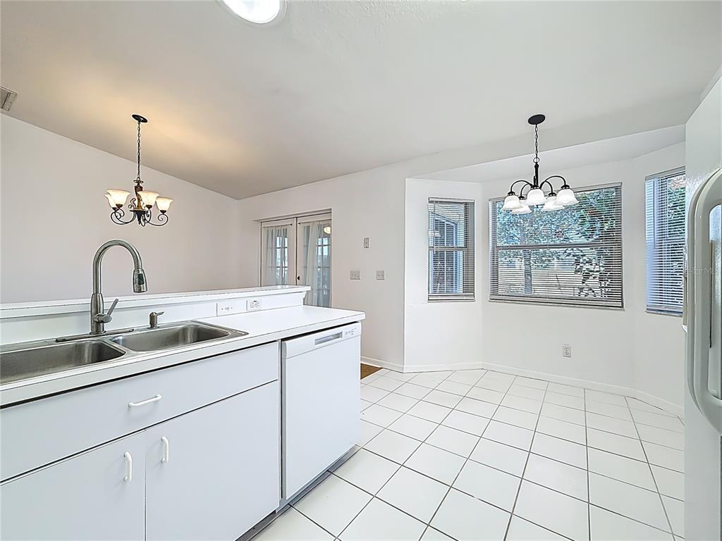 6175 Southwest 98th Loop Ocala, FL 34476 - Photo 21 of 56 a view of an entryway with kitchen and sink