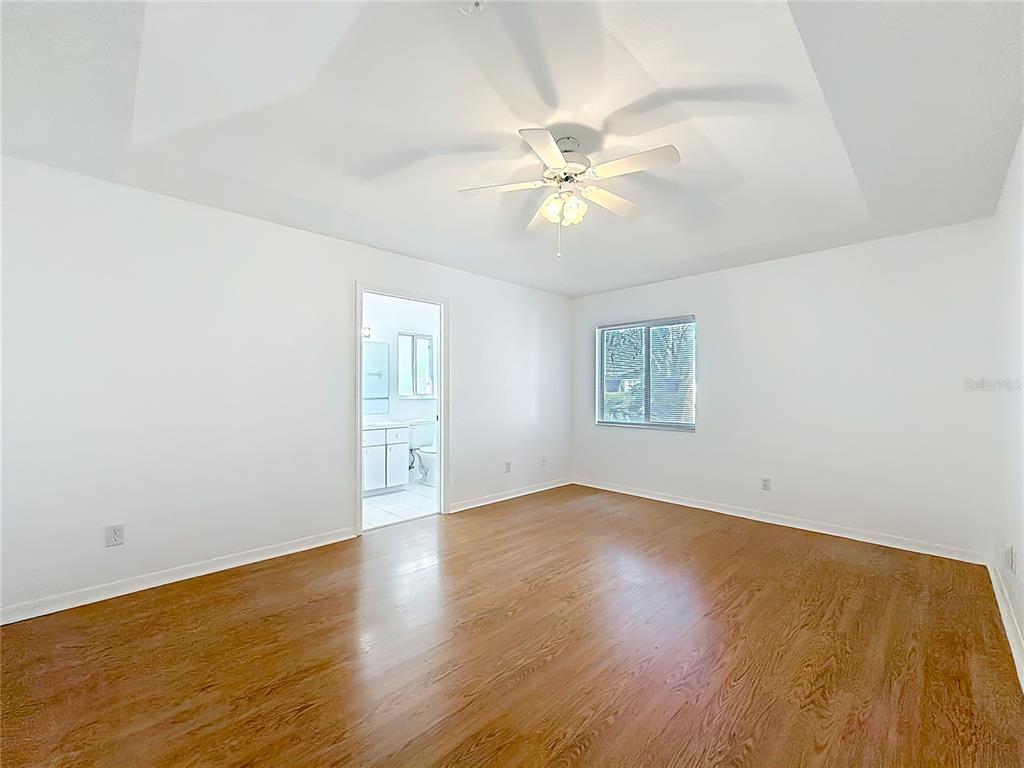 6175 Southwest 98th Loop Ocala, FL 34476 - Photo 30 of 56 a view of an empty room with wooden floor and a window