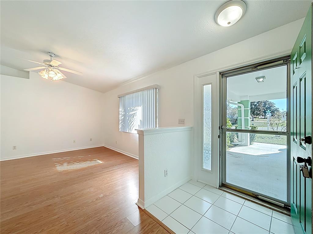 6175 Southwest 98th Loop Ocala, FL 34476 - Photo 4 of 56 an empty room with windows and entrance