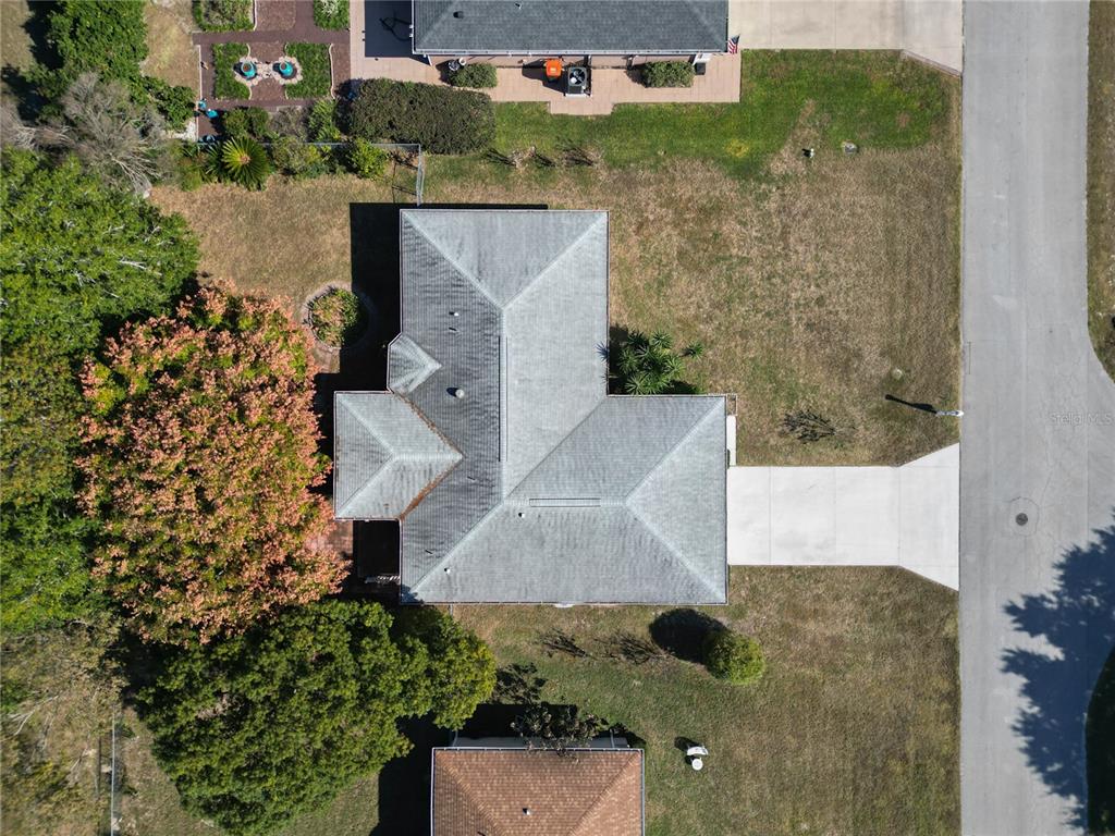 6175 Southwest 98th Loop Ocala, FL 34476 - Photo 47 of 56 an aerial view of a house with a yard